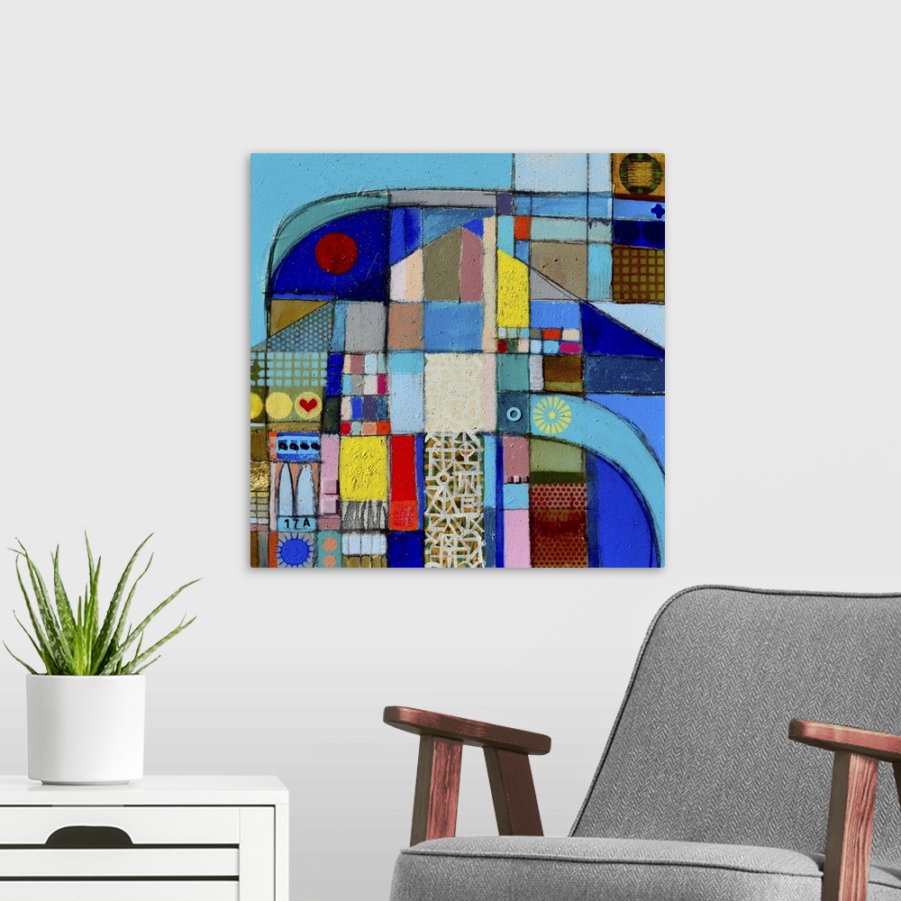 A modern room featuring Abstract artwork in a multitude of colors resembling a patchwork quilt.