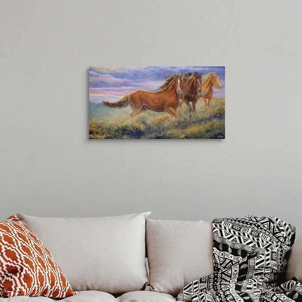 A bohemian room featuring three horses
