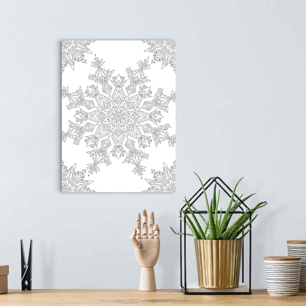 A bohemian room featuring Black and white line art of intricately designed snowflakes.