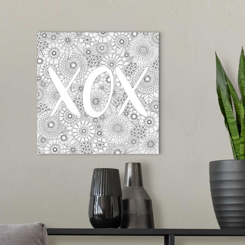 A modern room featuring Black and white line art with the letters "XOX" written on top of a floral background.