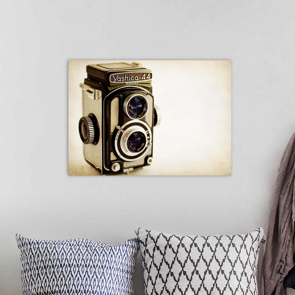 A bohemian room featuring Photograph of a vintage camera with a vintage sepia look to it.