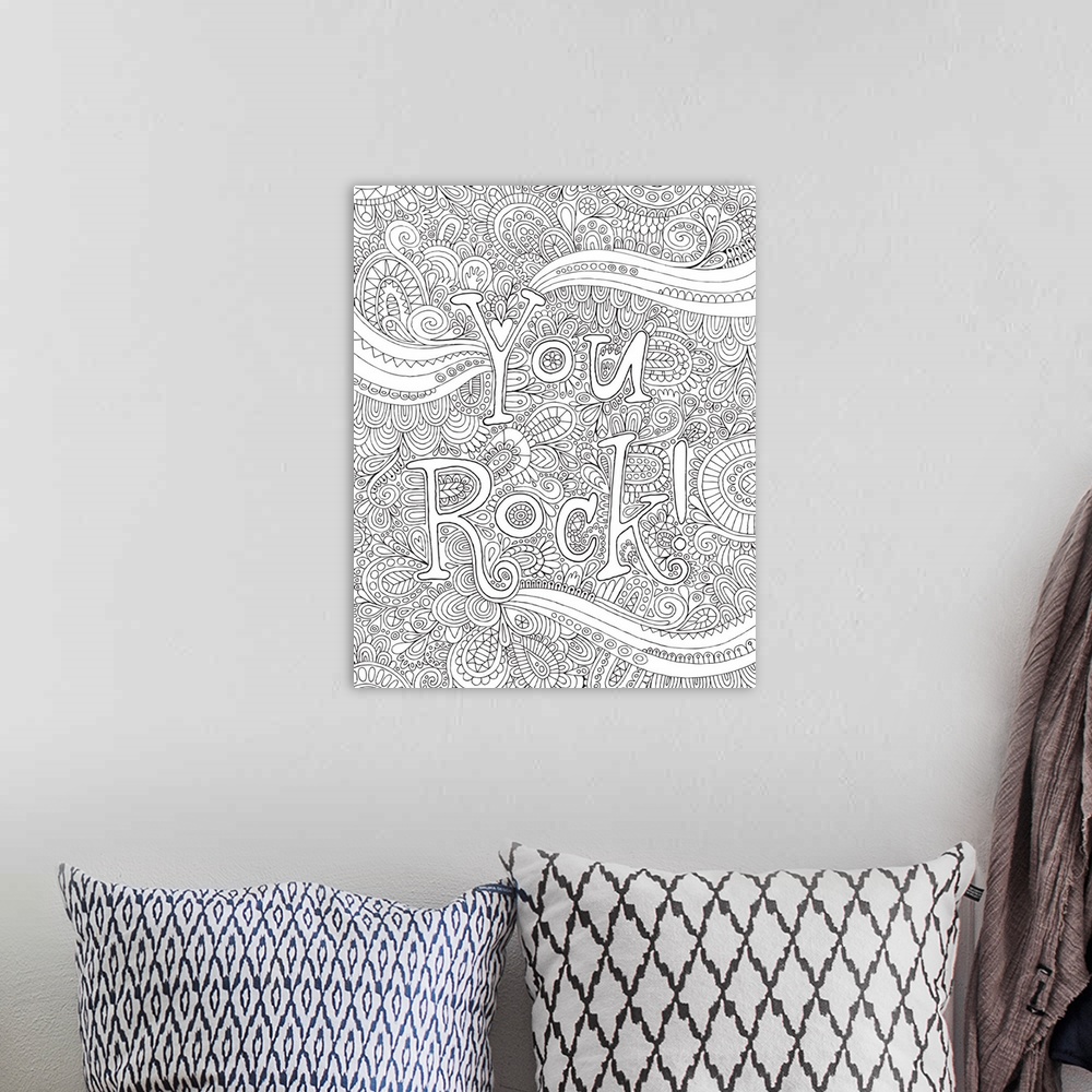A bohemian room featuring Black and white line art with the phrase "You Rock!" written on top of an intricate design.