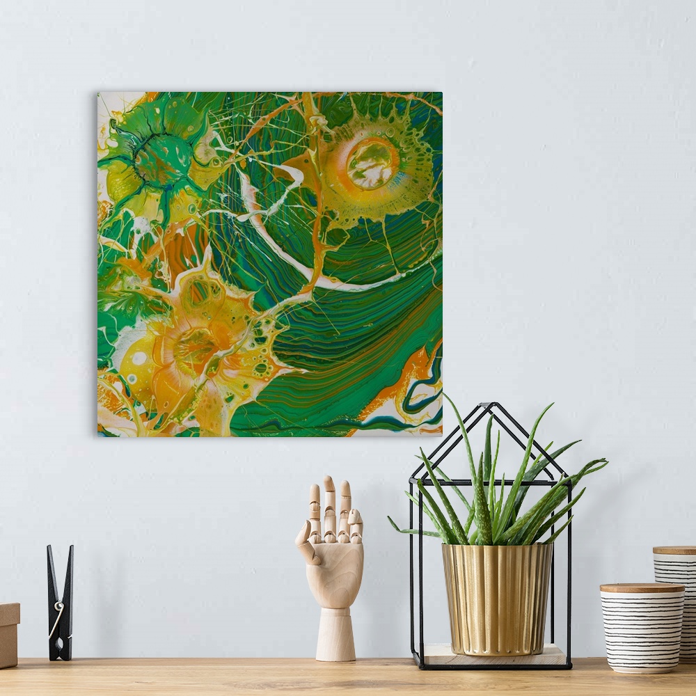 A bohemian room featuring Abstract pour painting in green and orange with the rippled effect and flowing shapes.