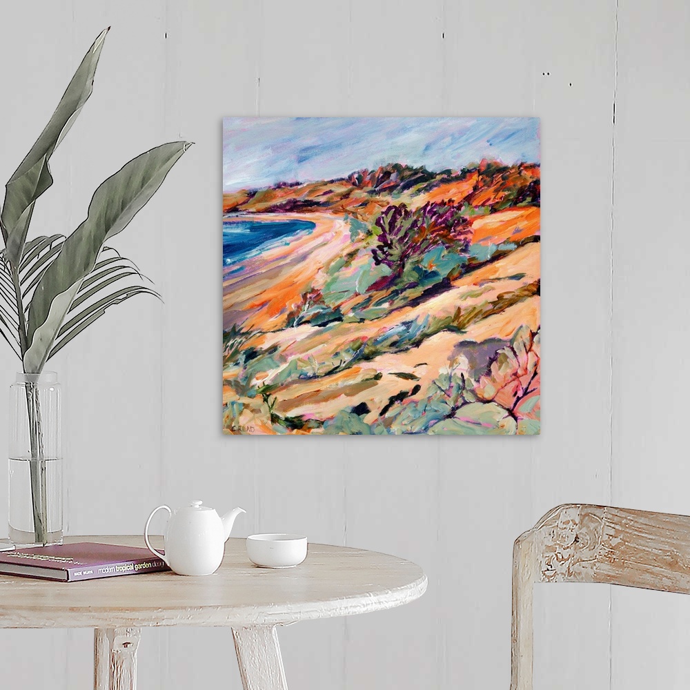A farmhouse room featuring Coastal view with beach, sea, and sand dune vegetation in pinks, purpless and blues.