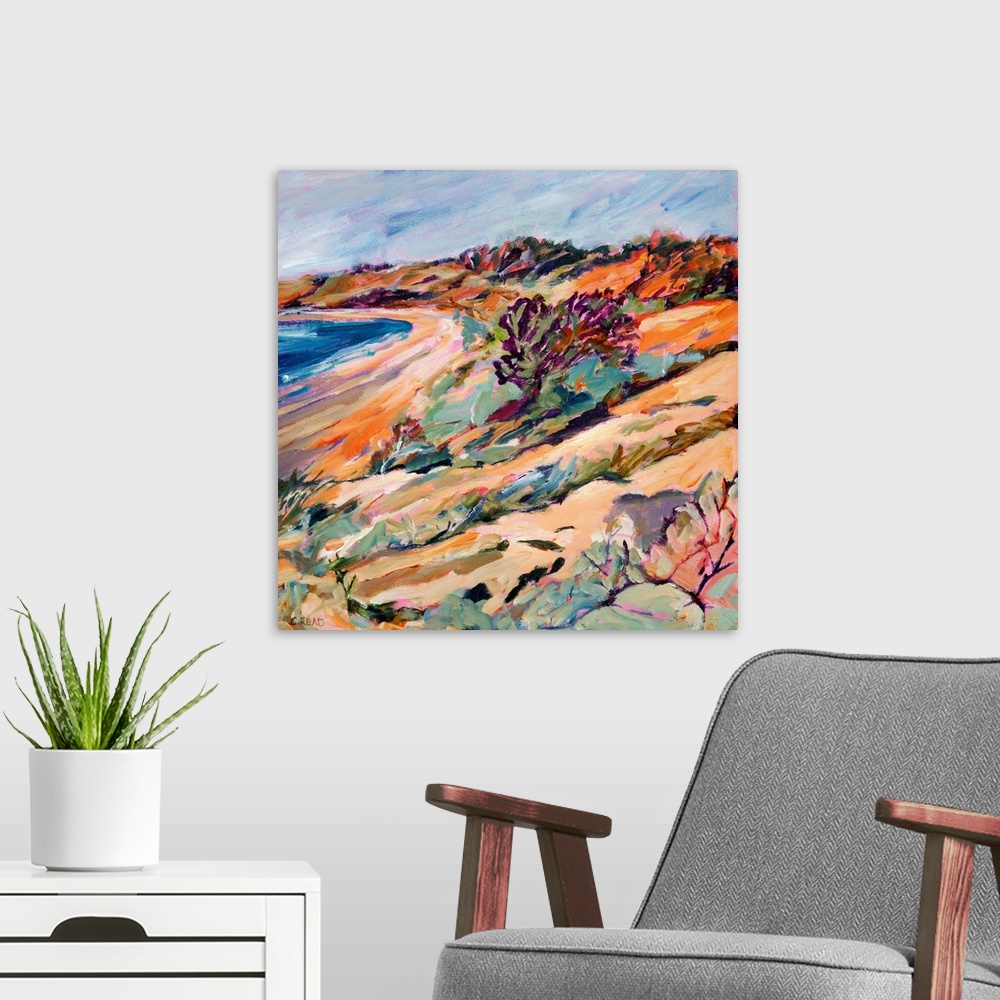A modern room featuring Coastal view with beach, sea, and sand dune vegetation in pinks, purpless and blues.