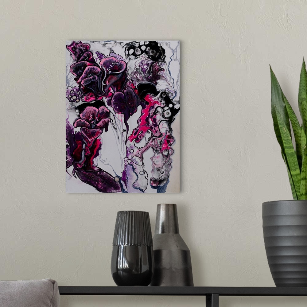 A modern room featuring Abstract painting of calla lilies using different shades and tints of purple, blue and pink.