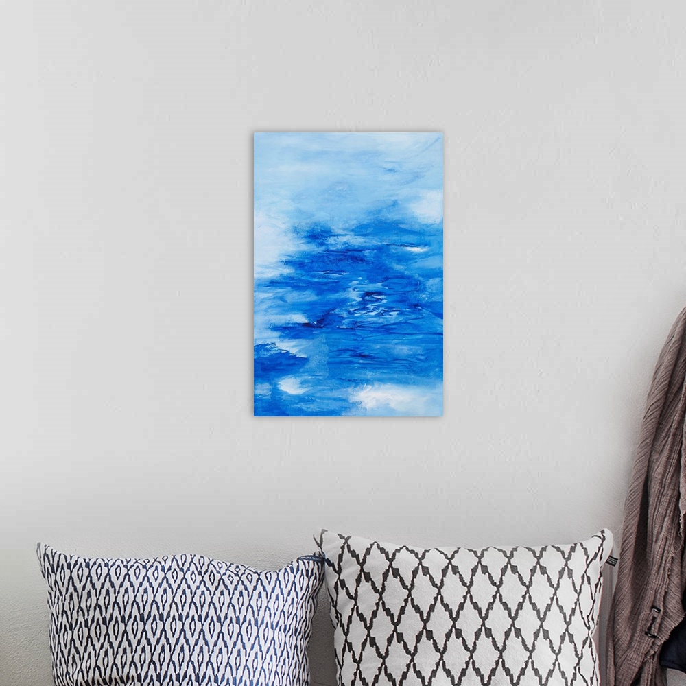 A bohemian room featuring Painting on paper of the ocean from the clouds.