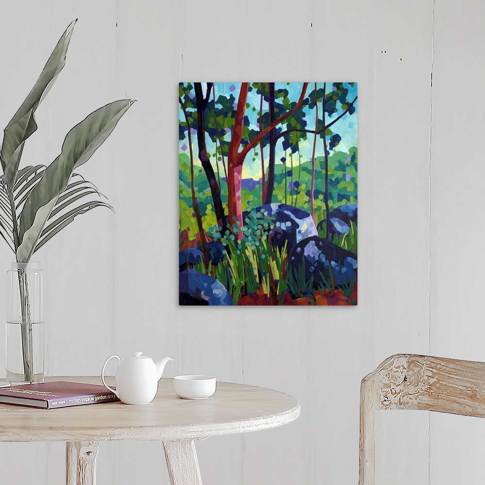 A farmhouse room featuring Painting of tree with red bark in the forest beside large blue and purple rocks.