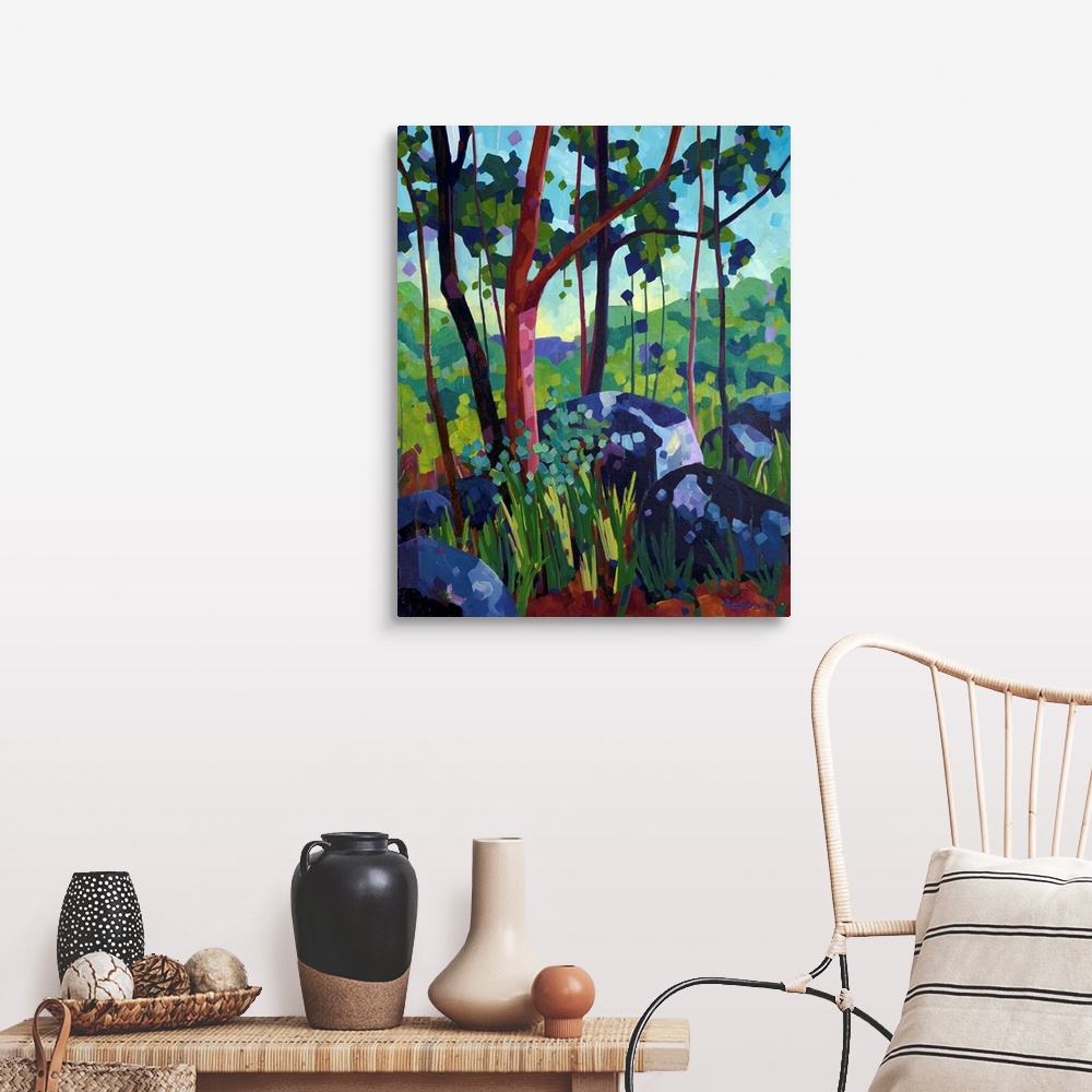 A farmhouse room featuring Painting of tree with red bark in the forest beside large blue and purple rocks.
