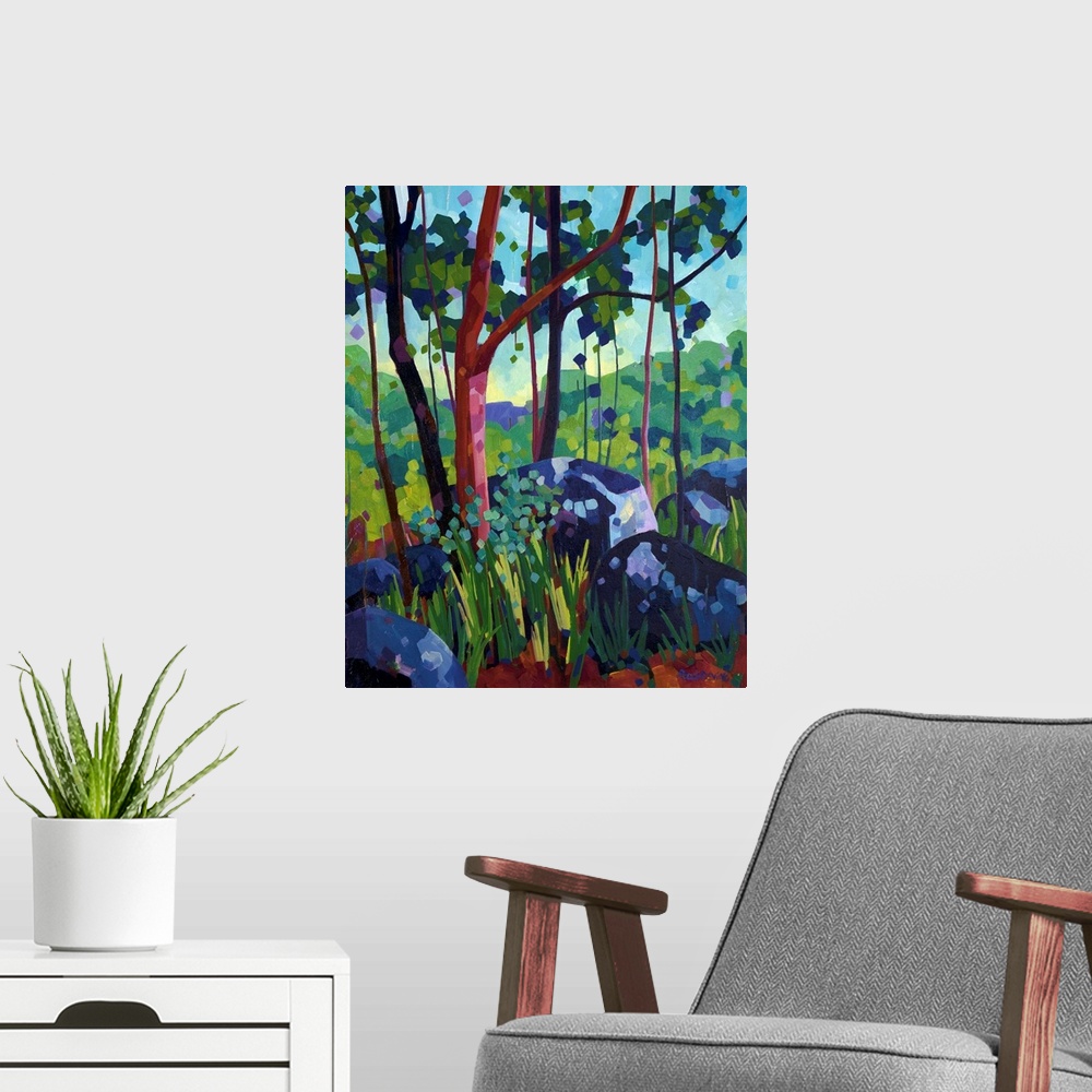 A modern room featuring Painting of tree with red bark in the forest beside large blue and purple rocks.