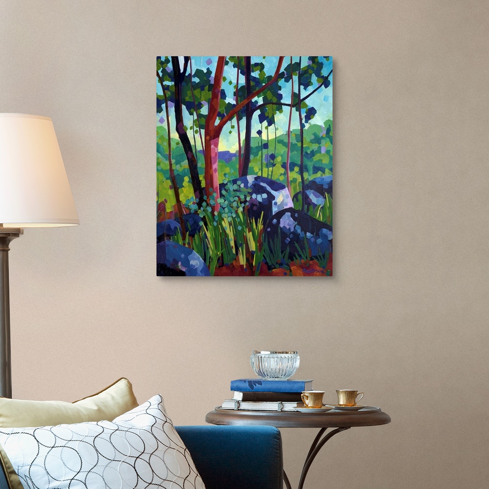 A traditional room featuring Painting of tree with red bark in the forest beside large blue and purple rocks.