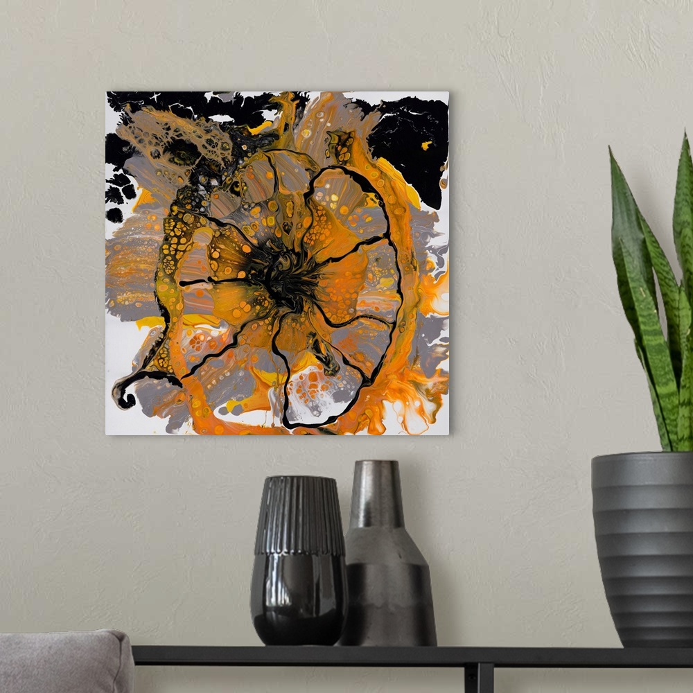 A modern room featuring Pour painting of a cowslip flower in orange and black colors on a background of primarily gray.