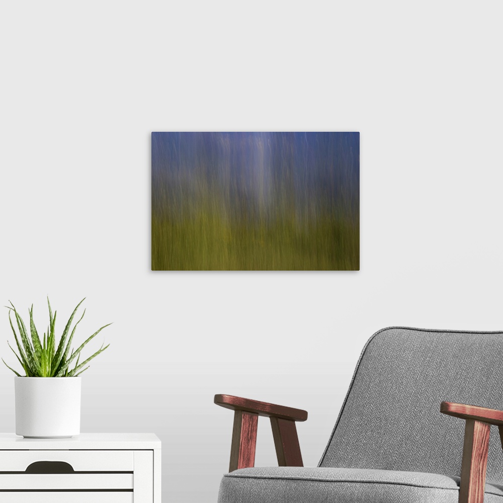 A modern room featuring Impressionist photograph of a dreamy blue and green ambience.