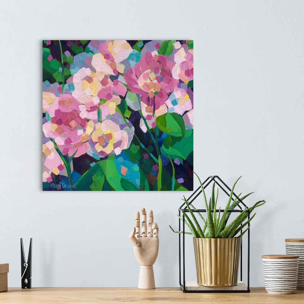 A bohemian room featuring Abstracted close up painting of pink roses and green leaves on a dark background.