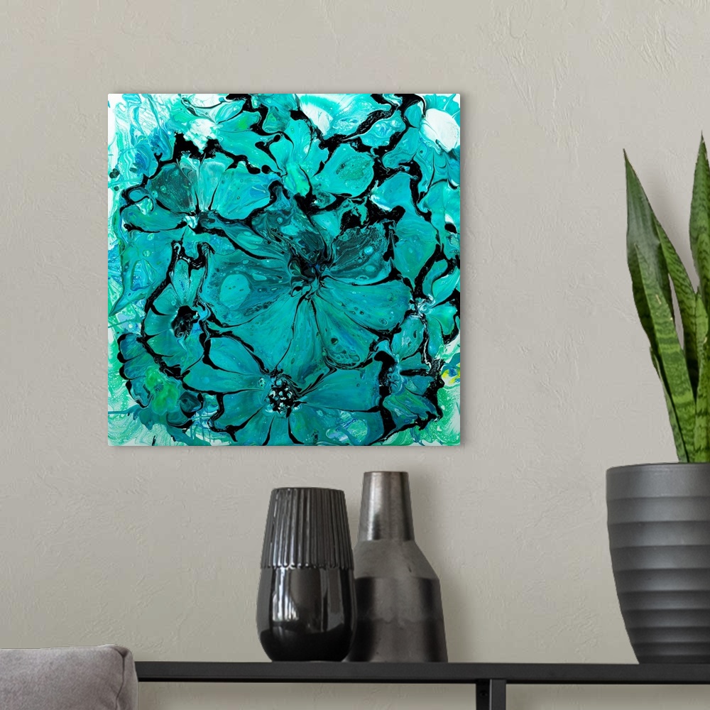 A modern room featuring Pour painting of flowers in bright turquoise colors with flowing patterns.