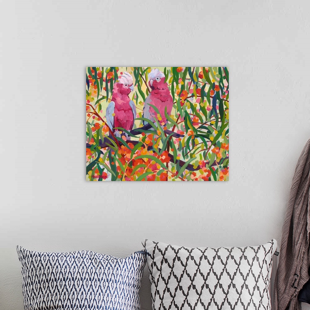 A bohemian room featuring Impressionist painting of two pink and grey cockatoos sitting in a eucalyptus tree with orange fl...