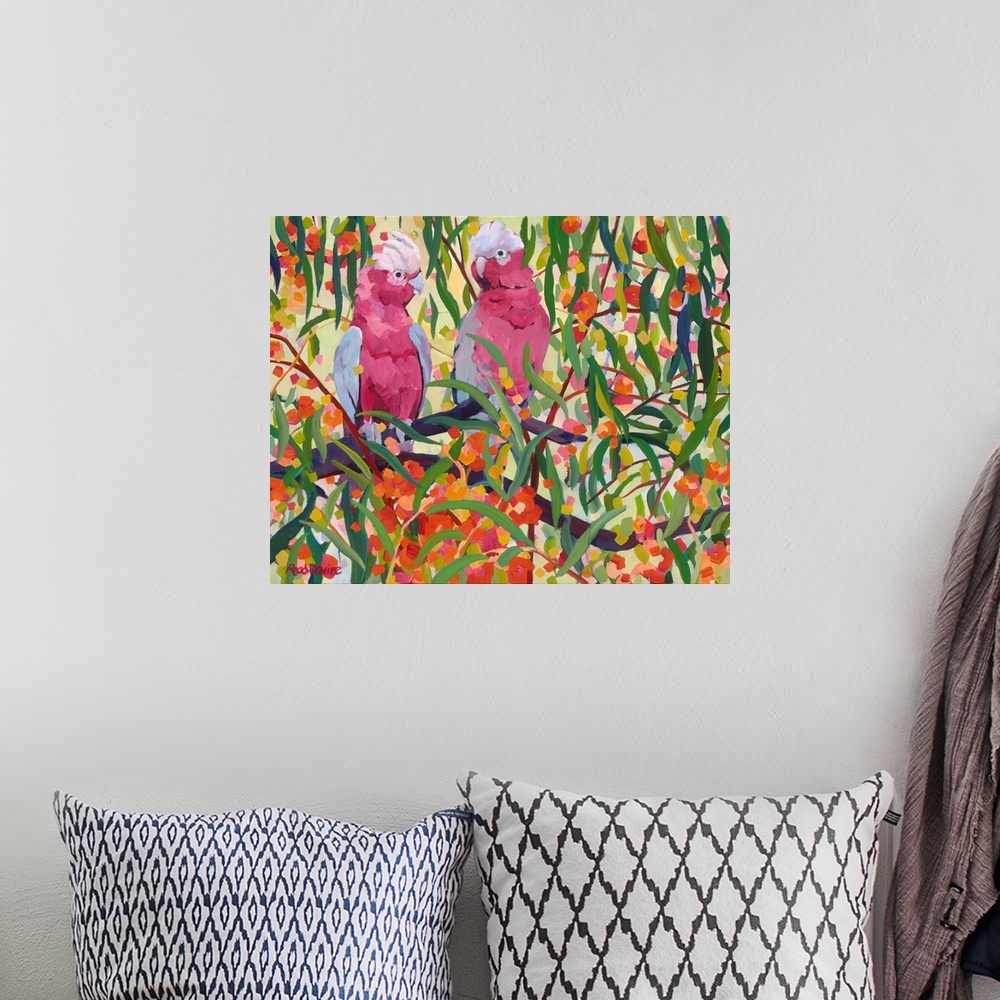 A bohemian room featuring Impressionist painting of two pink and grey cockatoos sitting in a eucalyptus tree with orange fl...