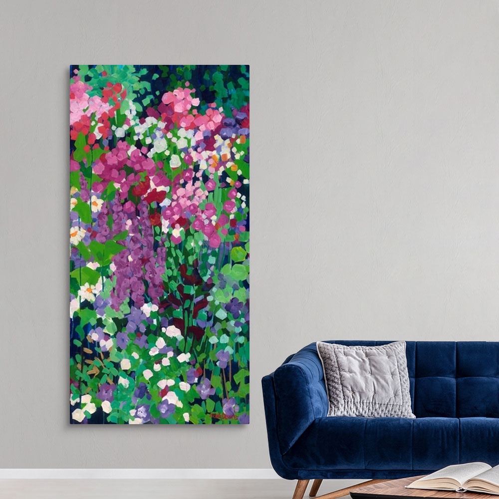 A modern room featuring Tall narrow painting of flowers in a garden with daisies and red and purple spired blooms.