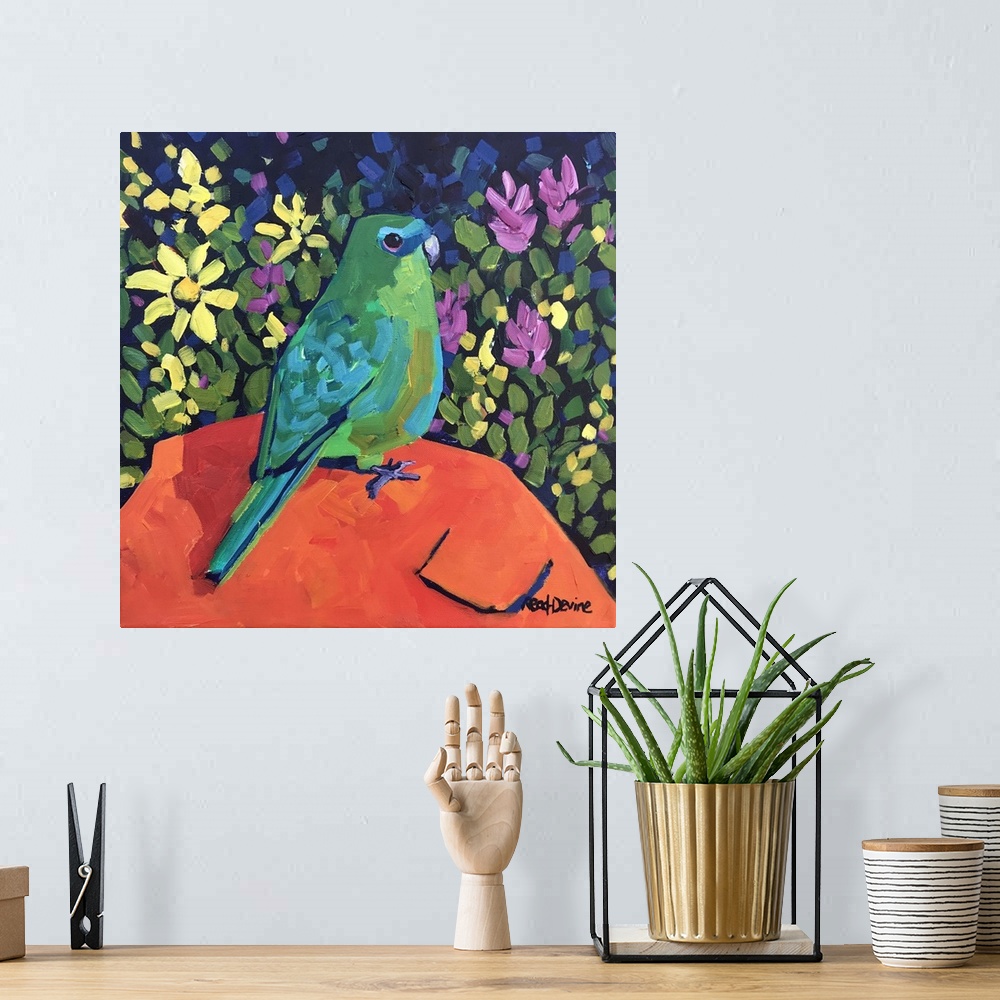 A bohemian room featuring NaAve painting of green parrot sitting on an orange rock with a background of flowers.