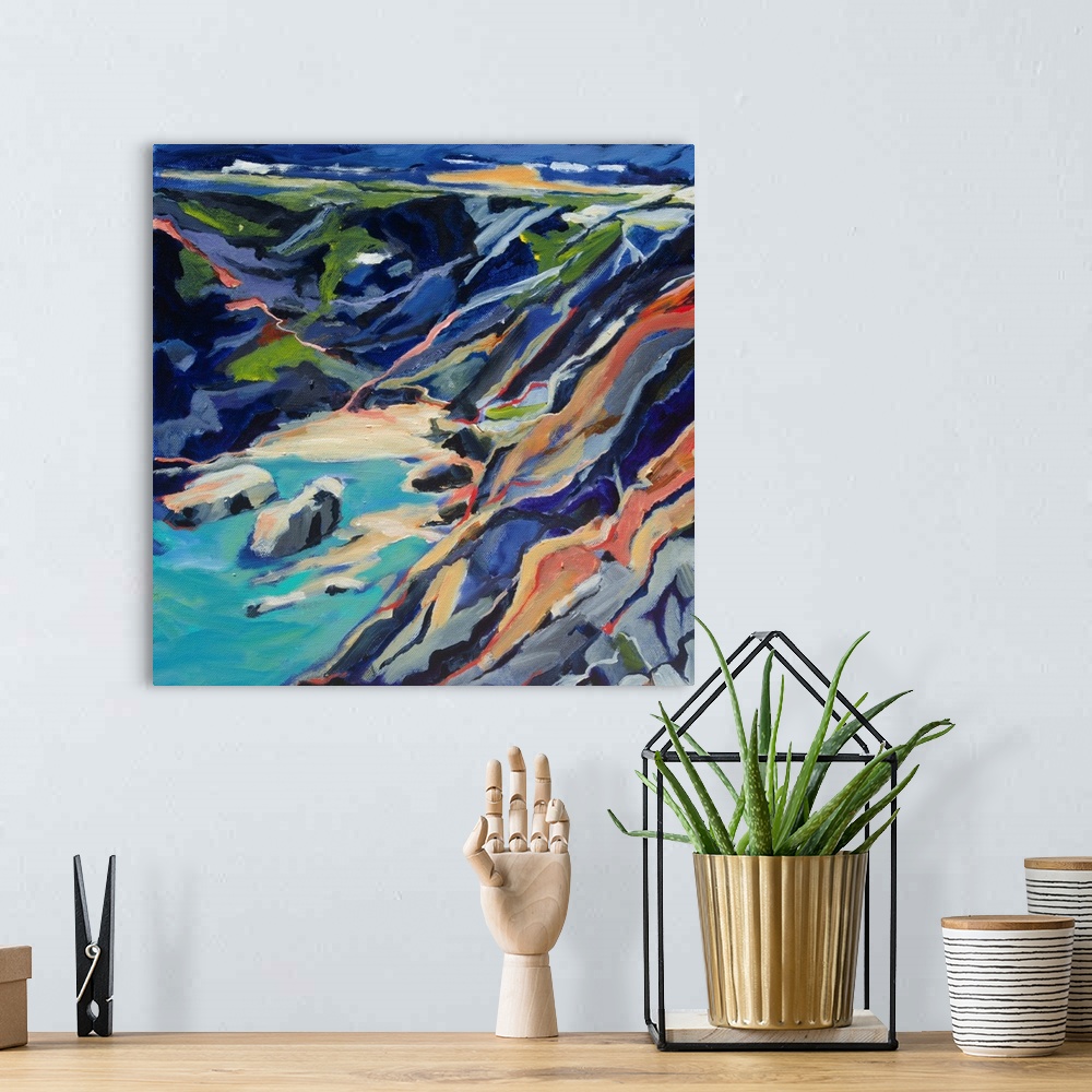 A bohemian room featuring A ontemporary scene of a rocky beach cove from above with turquoise and deep blues.