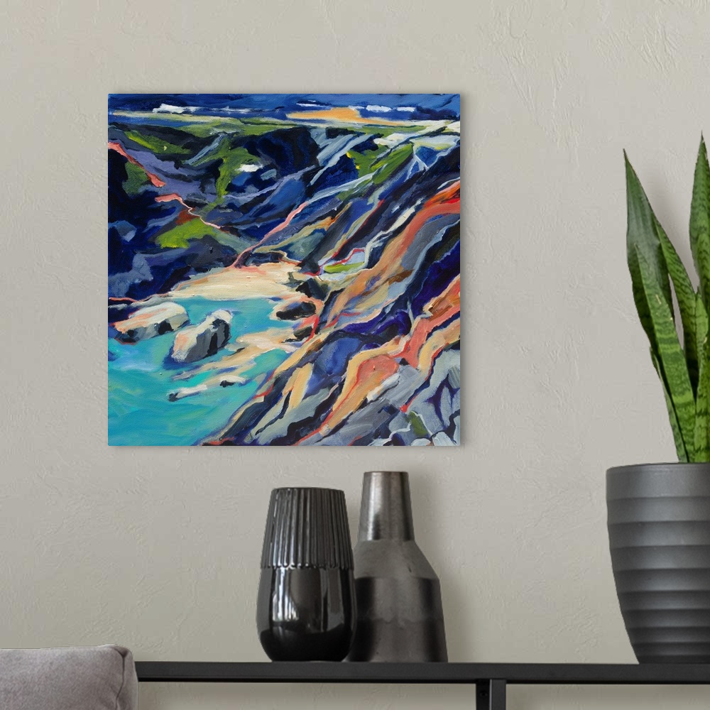 A modern room featuring A ontemporary scene of a rocky beach cove from above with turquoise and deep blues.