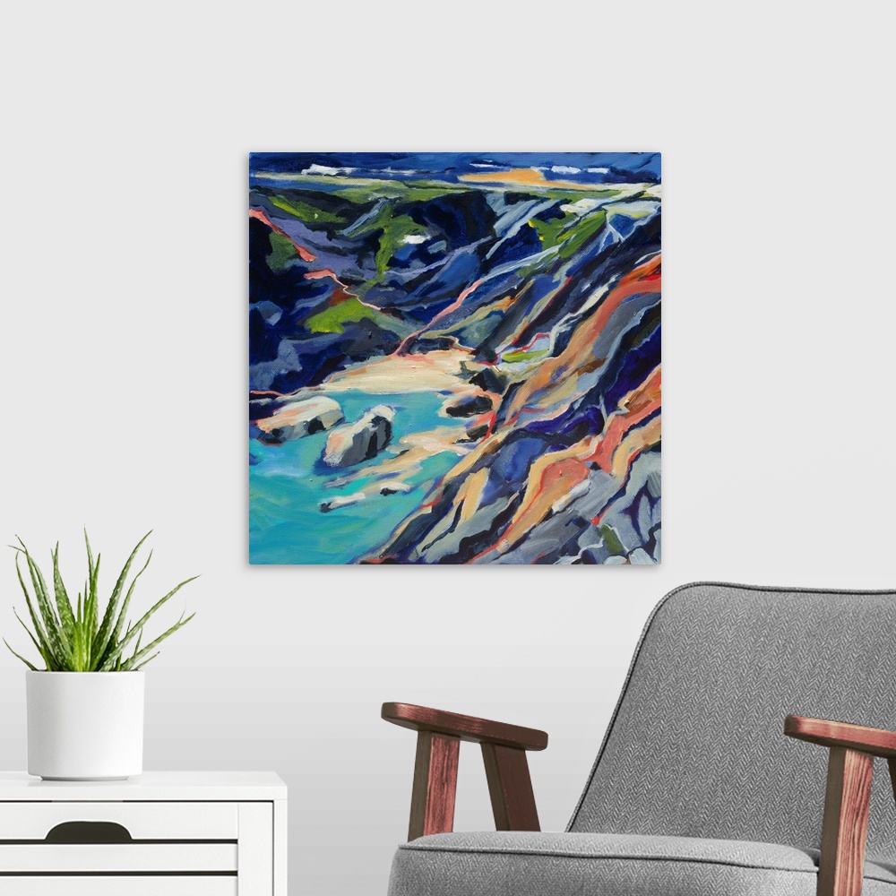 A modern room featuring A ontemporary scene of a rocky beach cove from above with turquoise and deep blues.