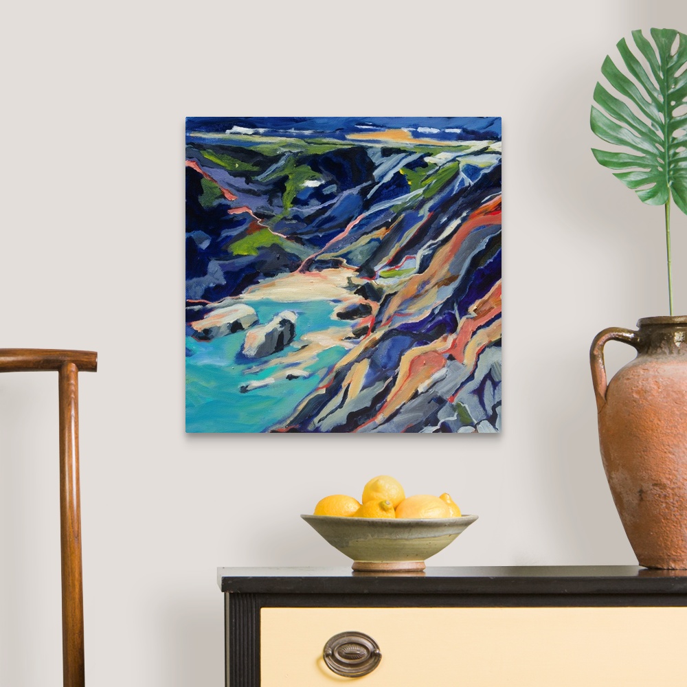 A traditional room featuring A ontemporary scene of a rocky beach cove from above with turquoise and deep blues.