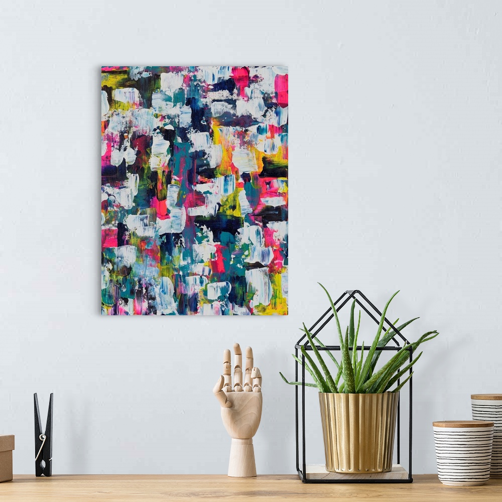 A bohemian room featuring Painting on canvas of many different aspects of a vibrant palette.