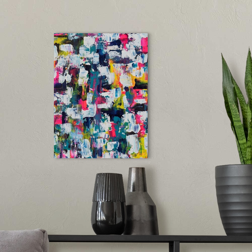 A modern room featuring Painting on canvas of many different aspects of a vibrant palette.