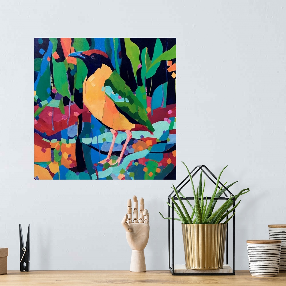 A bohemian room featuring Yellow green and red rainforest bird painting standing amongst abstract colorful shapes.