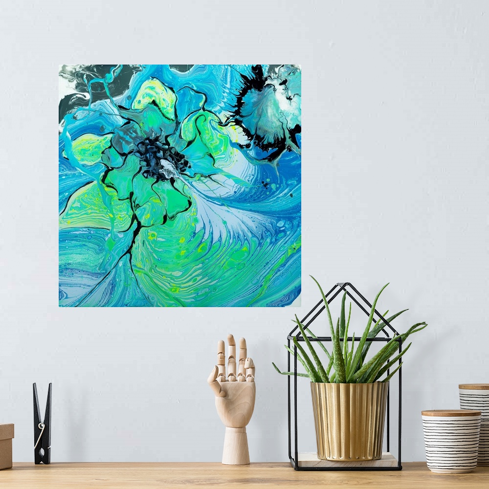 A bohemian room featuring Abstract painting in pouring technique using consecutive layers of blue and green paint to create...