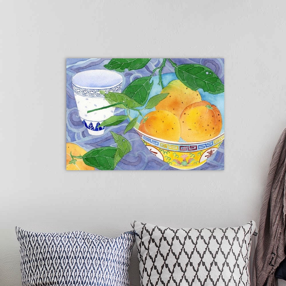 A bohemian room featuring Home grown oranges in a yellow Chinese bowl and blue and white teacup with a backdrop of 'Chinese...