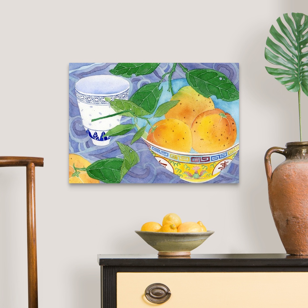 A traditional room featuring Home grown oranges in a yellow Chinese bowl and blue and white teacup with a backdrop of 'Chinese...