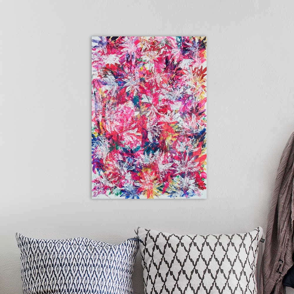 A bohemian room featuring Painting on paper of a dense compilation of leaves in vibrant spring tones.