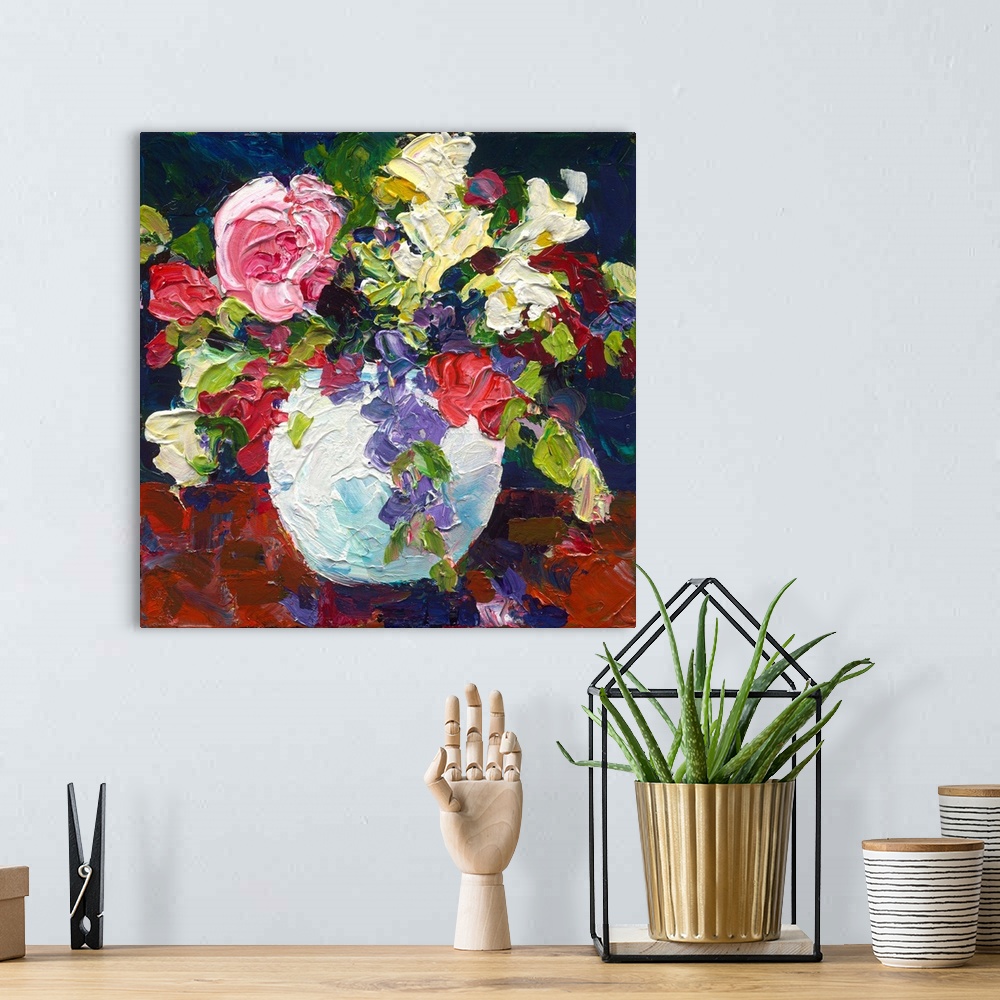 A bohemian room featuring Roses and foliage in a white vase painted with thick textured paint.