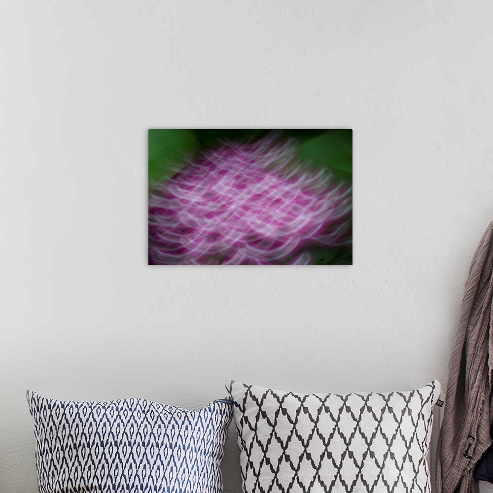 A bohemian room featuring Impressionist photograph of a group of flowers.