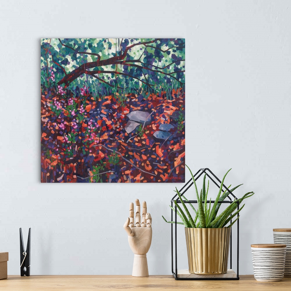 A bohemian room featuring Atmospheric painting of fallen tree with pink flowers and red and orange foreground.