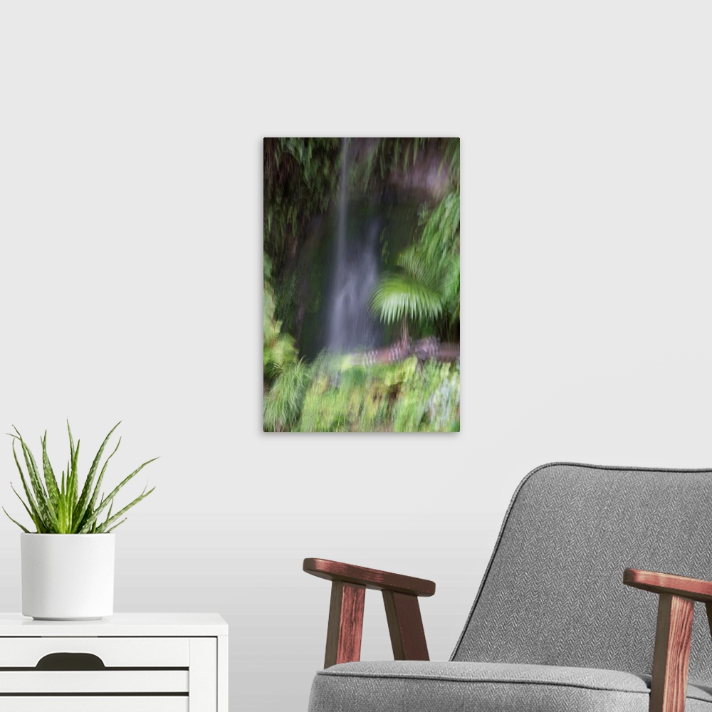 A modern room featuring Impressionist photograph of a waterfall in the Eden garden.