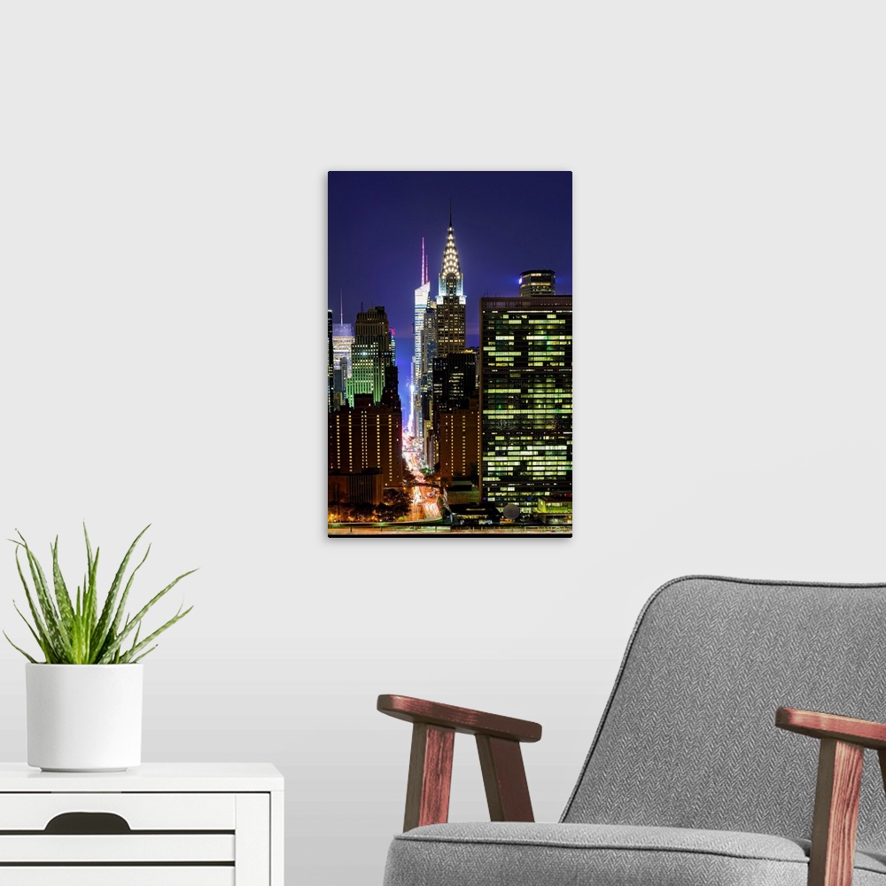 A modern room featuring Chrysler Building And UN At Night
