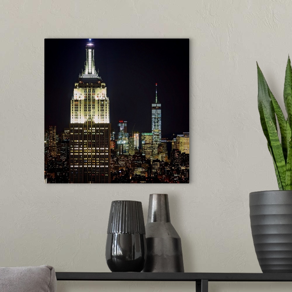 A modern room featuring Empire State Building And Freedom Tower At Night