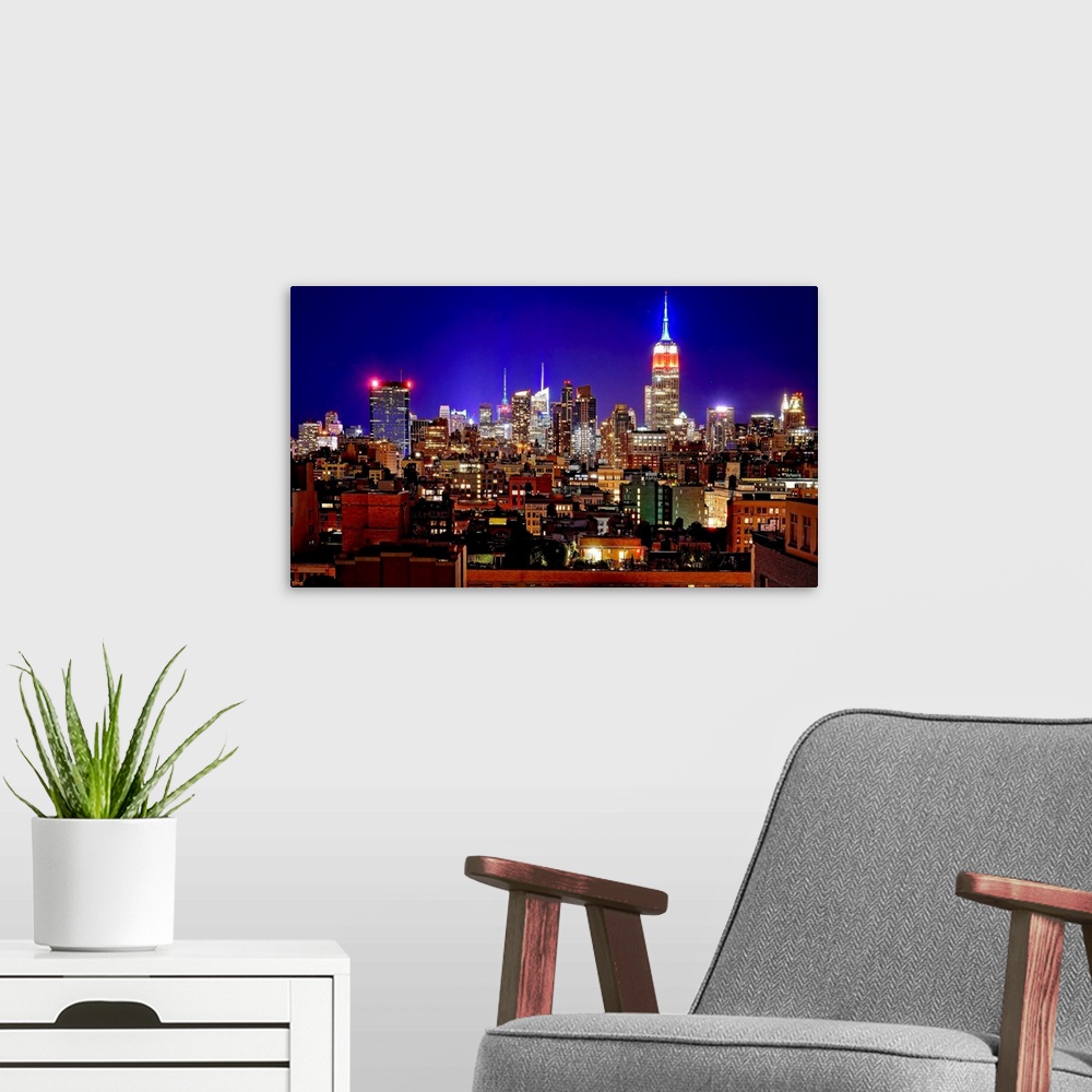 A modern room featuring Empire State Building And Manhattan At Night