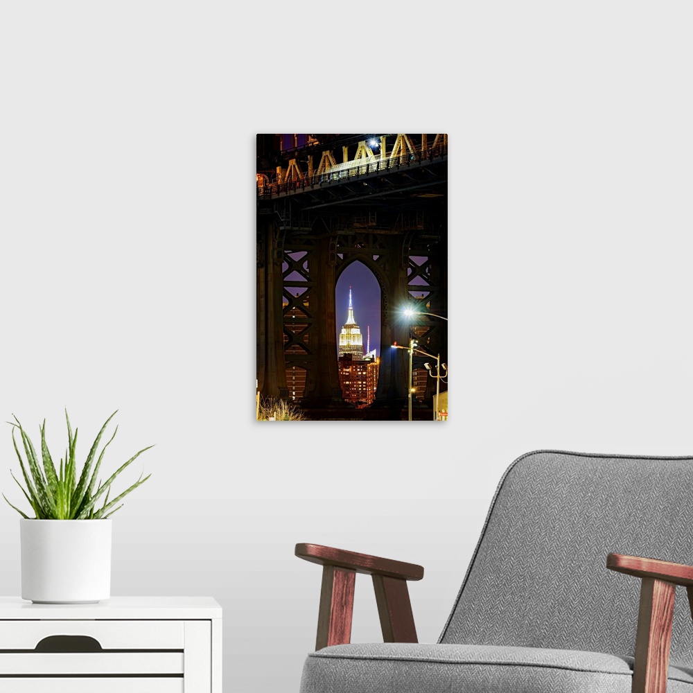 A modern room featuring Empire State Building Through Manhattan Bridge