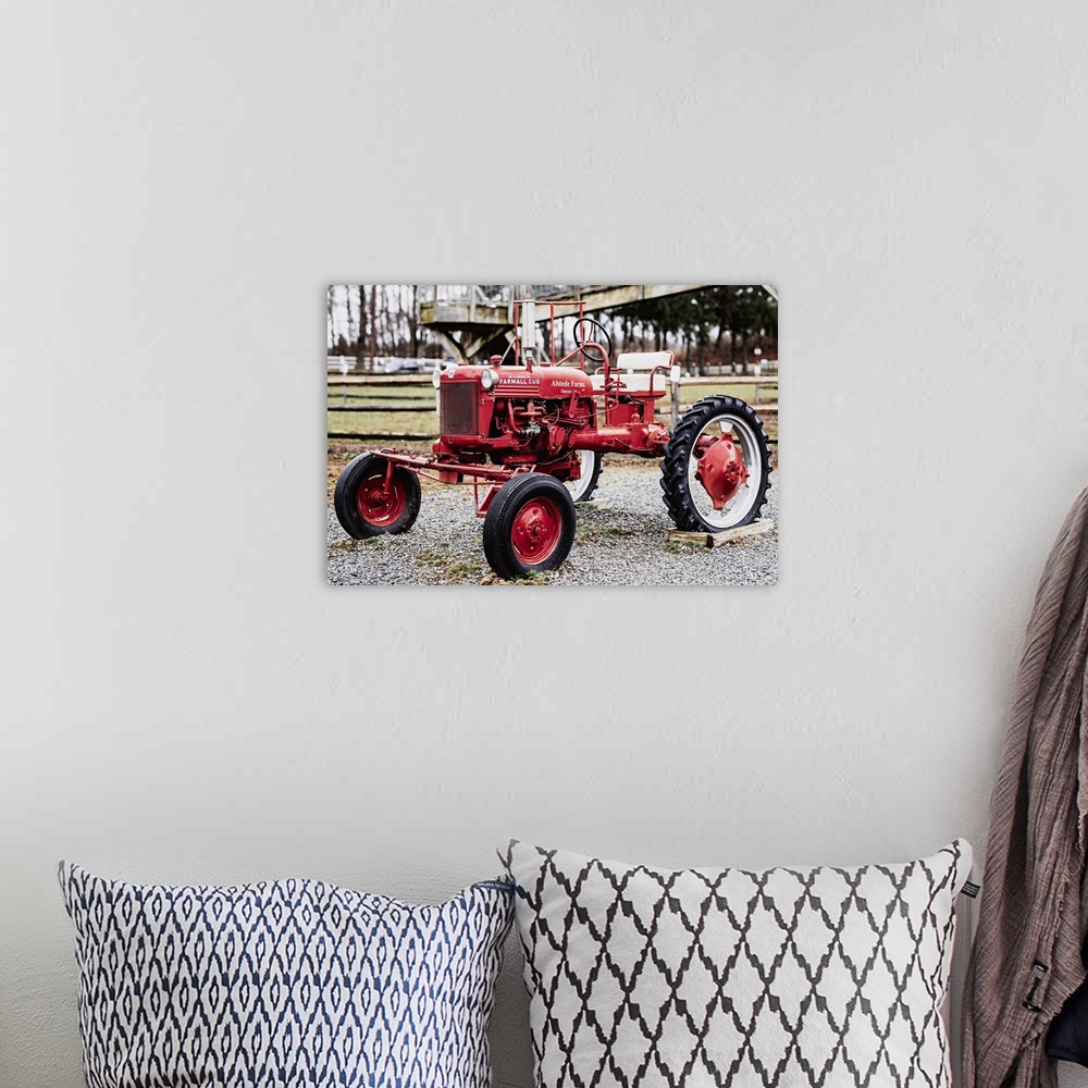 A bohemian room featuring International Harvester McCormick Farmall Cub Farm Tractor