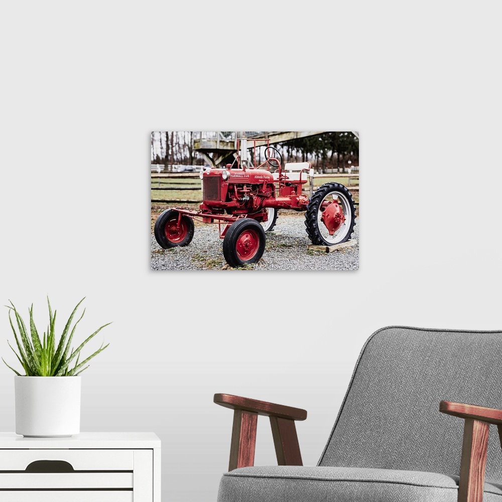 A modern room featuring International Harvester McCormick Farmall Cub Farm Tractor