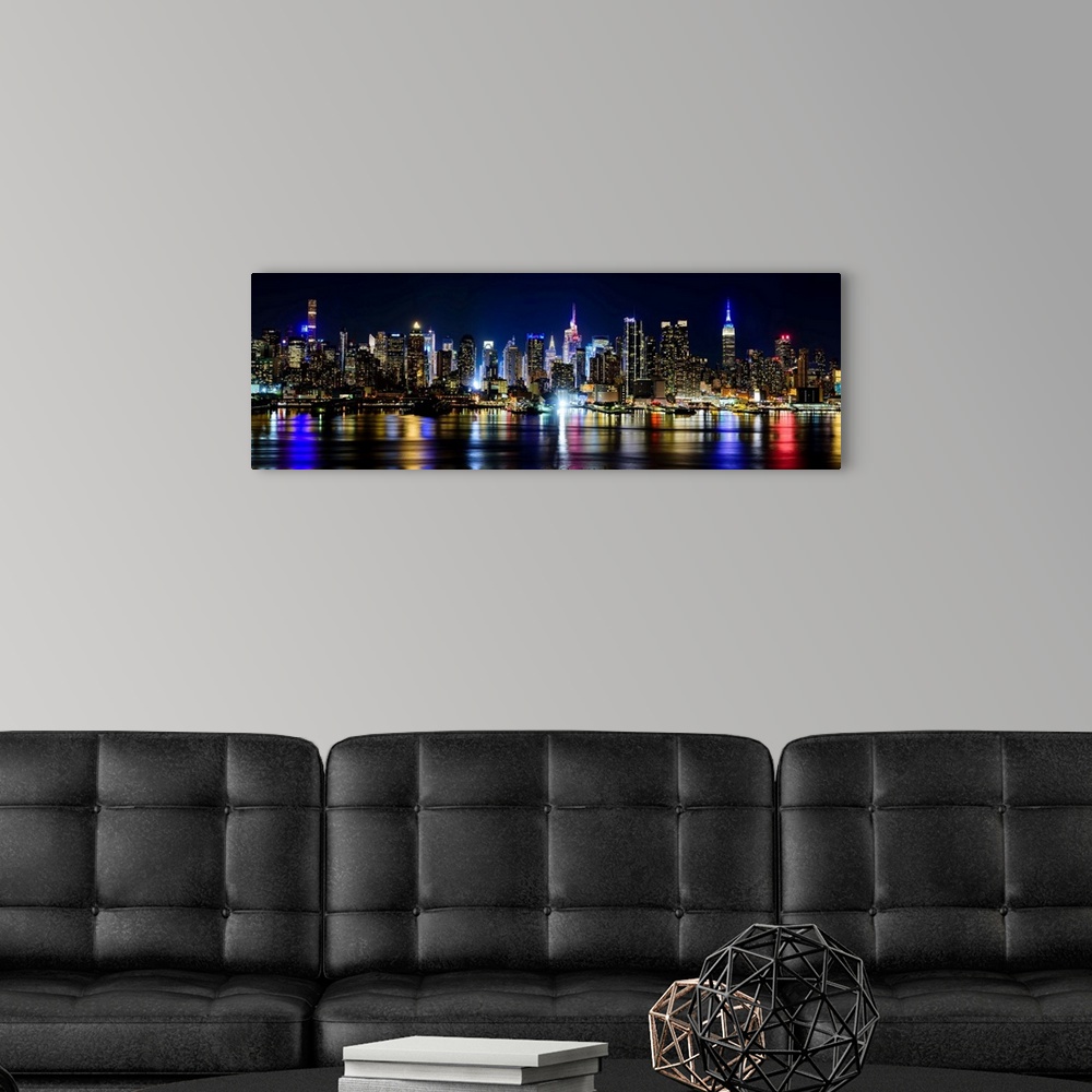 A modern room featuring Manhattan Panoramic View At Night