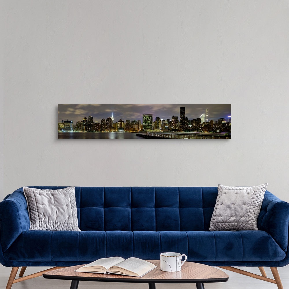 A modern room featuring Manhattan Panoramic View On East River At Night