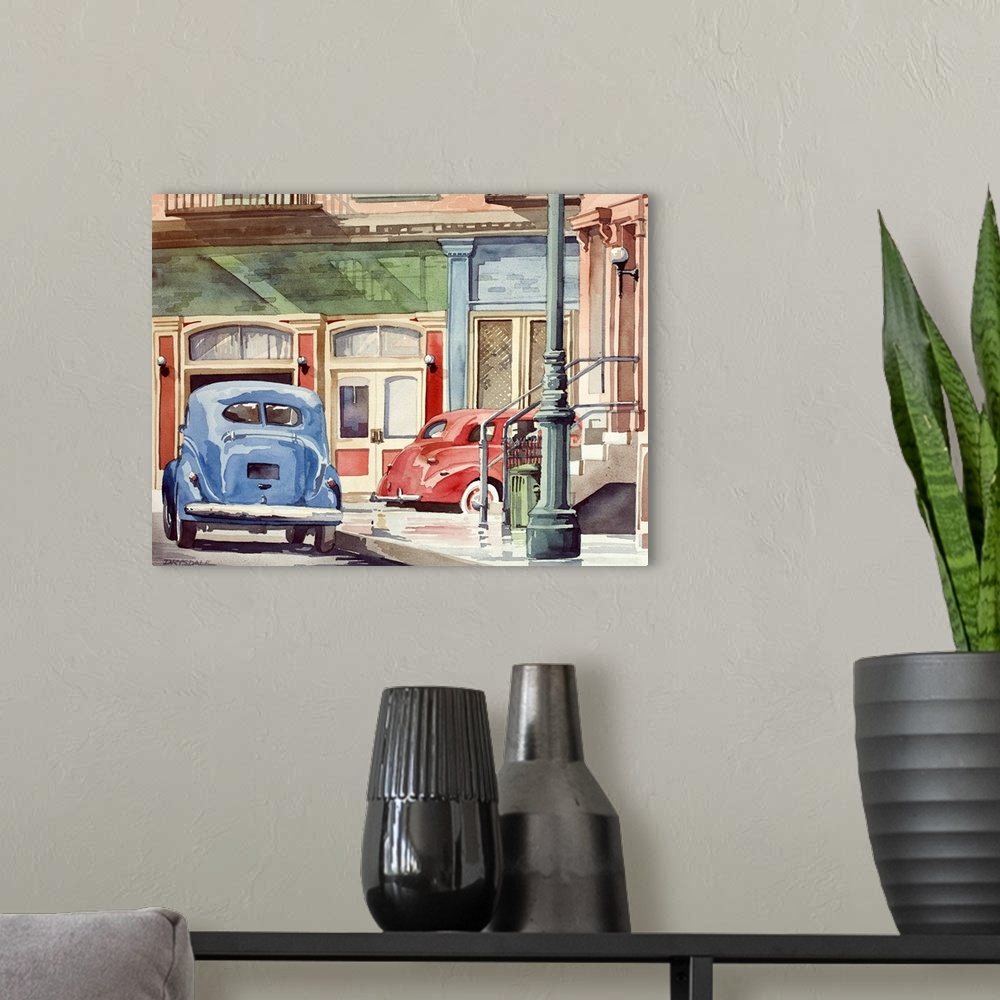 A modern room featuring Contemporary watercolor painting of a red and blue Volkswagen beetles driving down Main Street