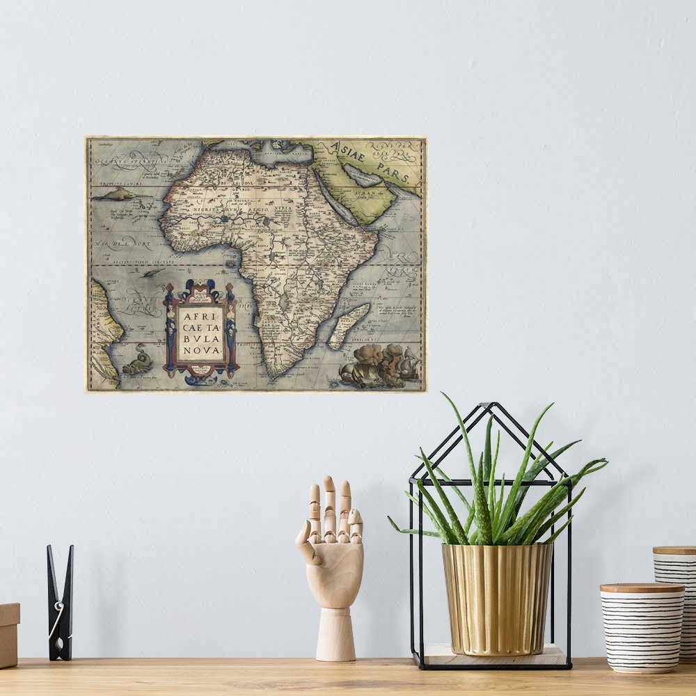 A bohemian room featuring This large piece is a vintage map of Africa from the 16th century.