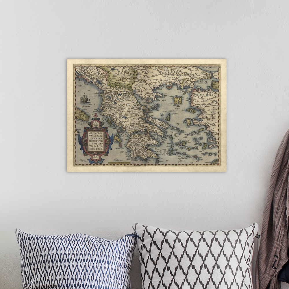A bohemian room featuring This large piece is an antique map dated back to 1570 of the country Greece.