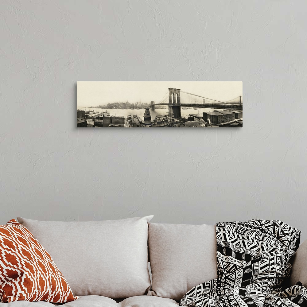 A bohemian room featuring A vintage photograph of a the Brooklyn bridge spanning the East River toward Manhattan.